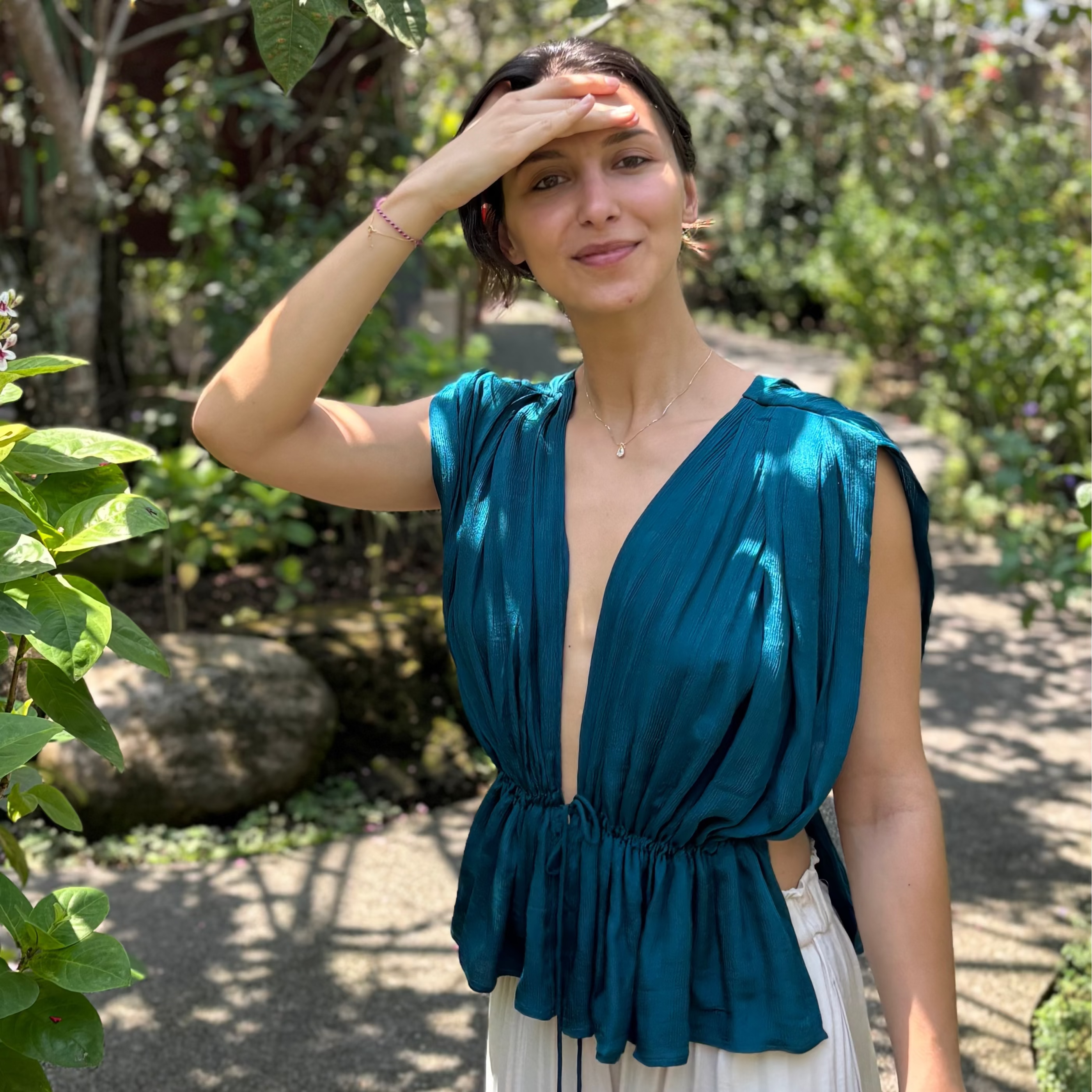 Neel minimalist draped silk satin top in deep turquoise.